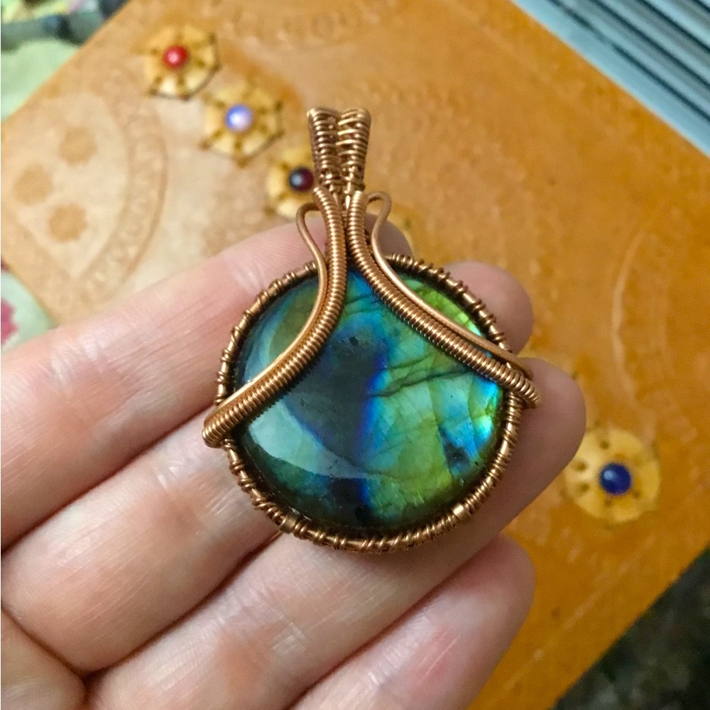 Labradorite Circle wrapped in copper wire.